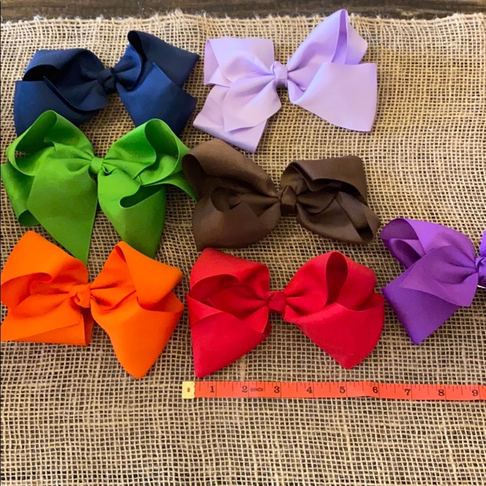 Lot of 7 solid color large bows.